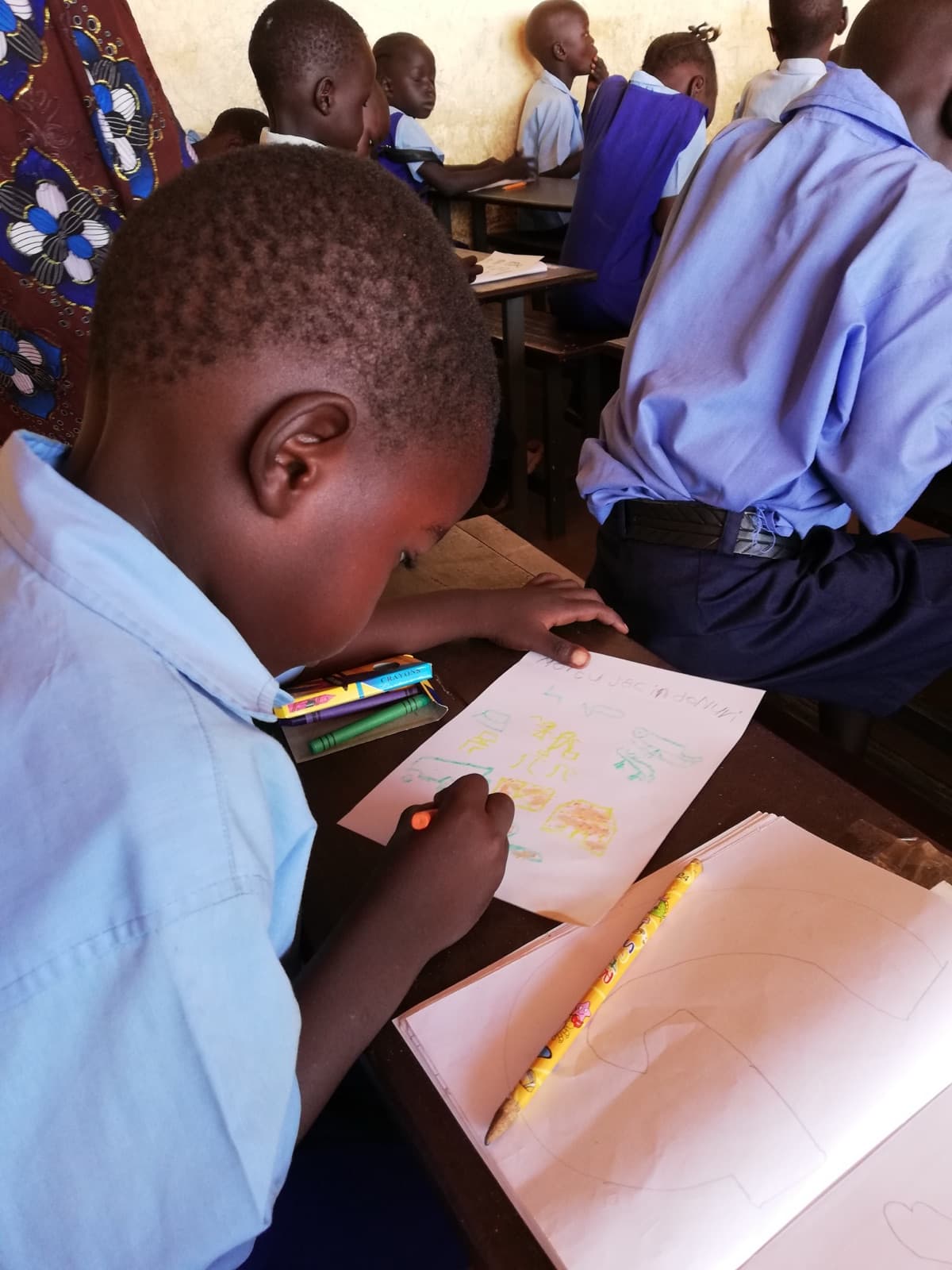 A pupil drawing in class