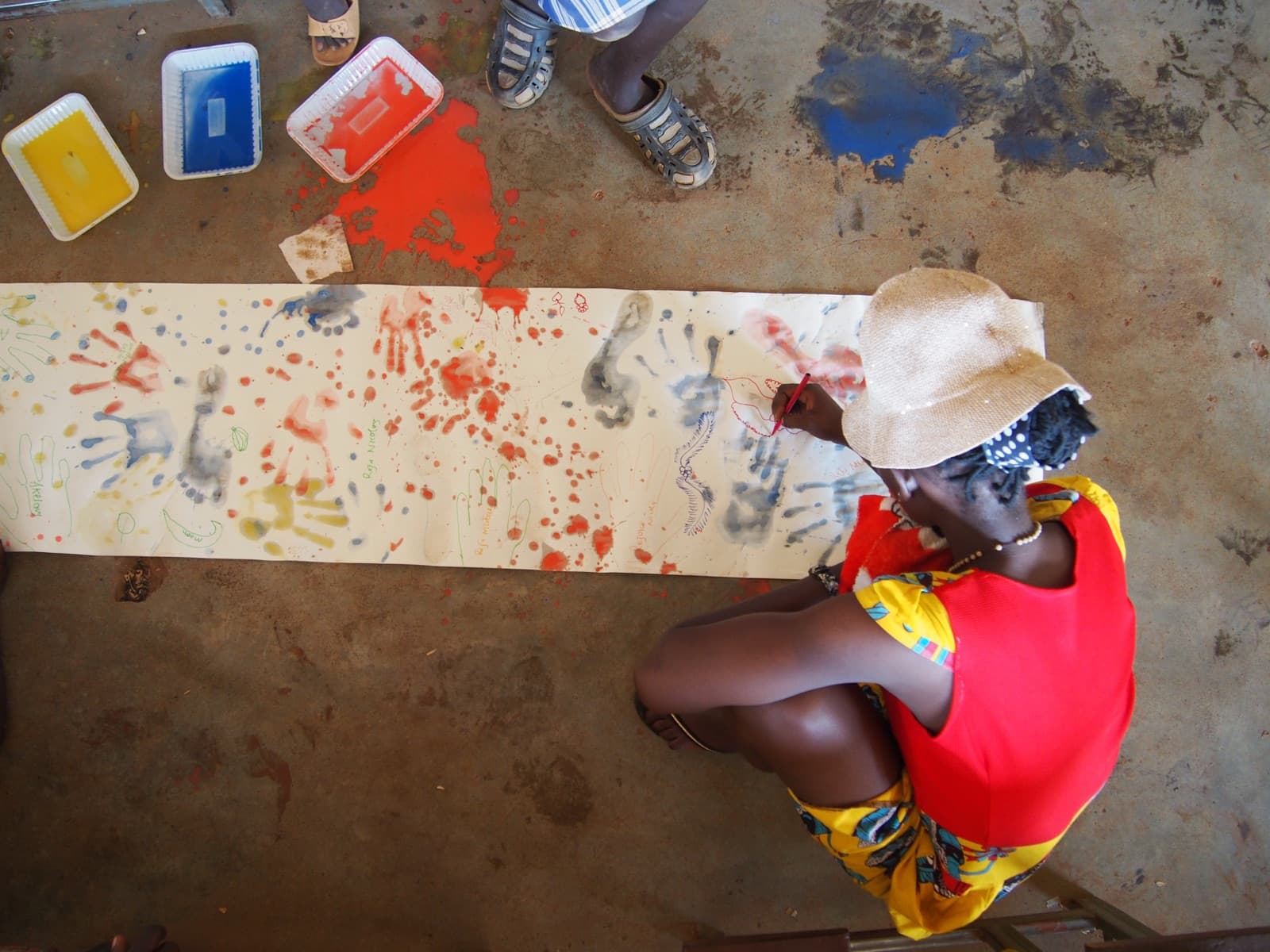 A child painting at the center